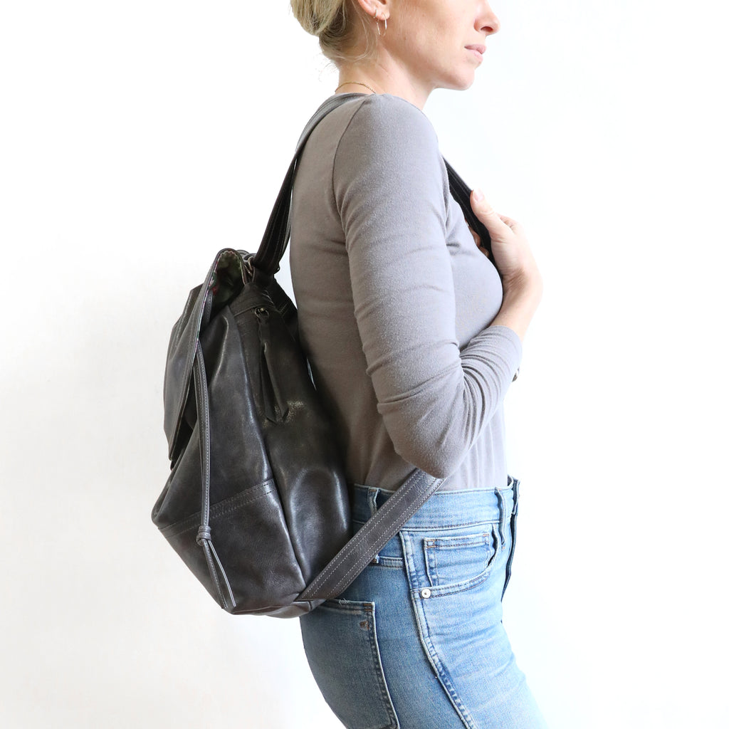 Side view of model weating 1904 large as a backpack. 