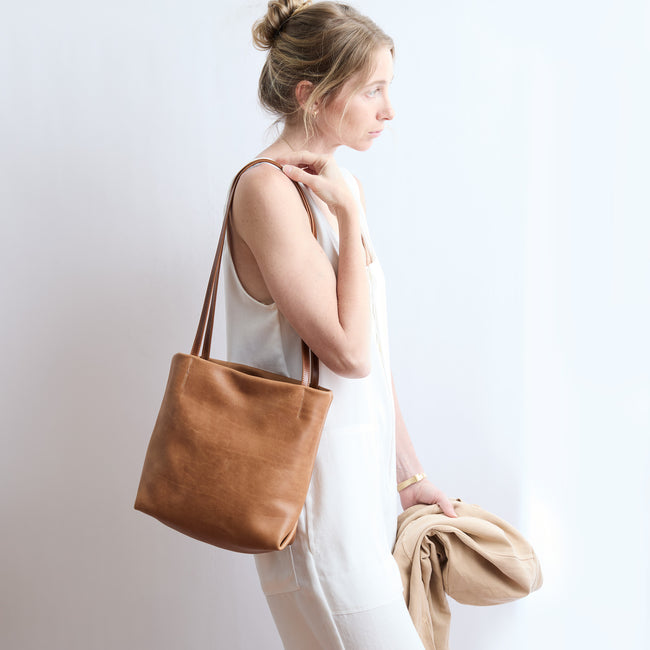model / one size / dark | model wearing ballet tote on her shoulder