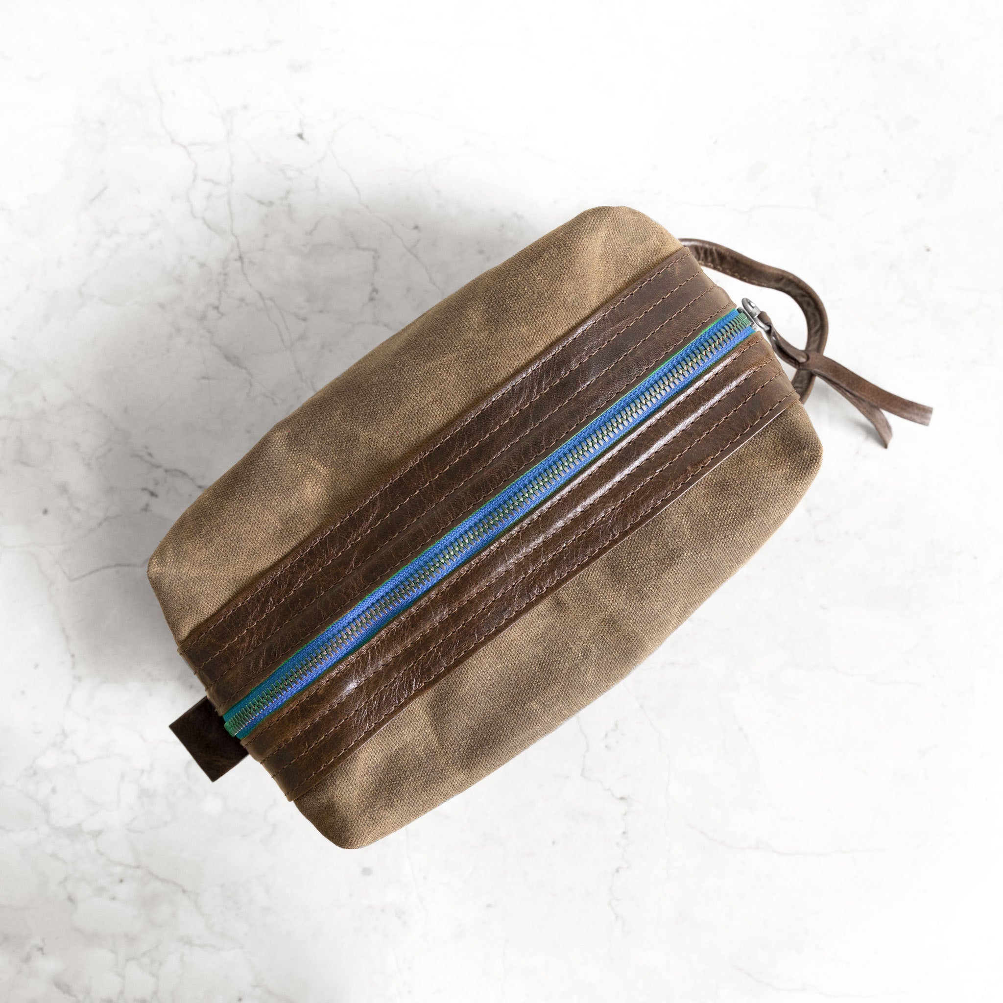indigo zippere ditty in rustic pecan