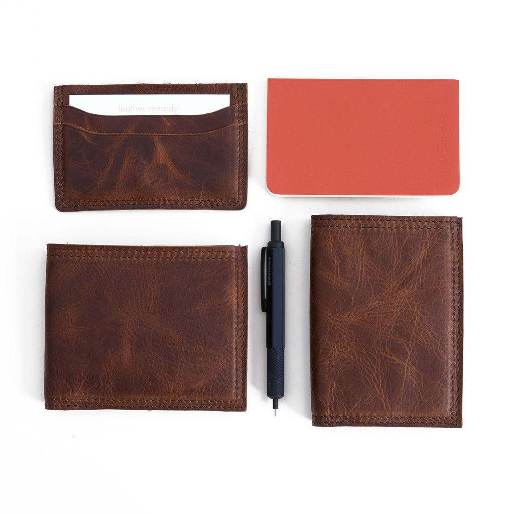 bifold wallet in fuentes in bottom left corner, five slot wallet top left, and vertical bifold bottom right 