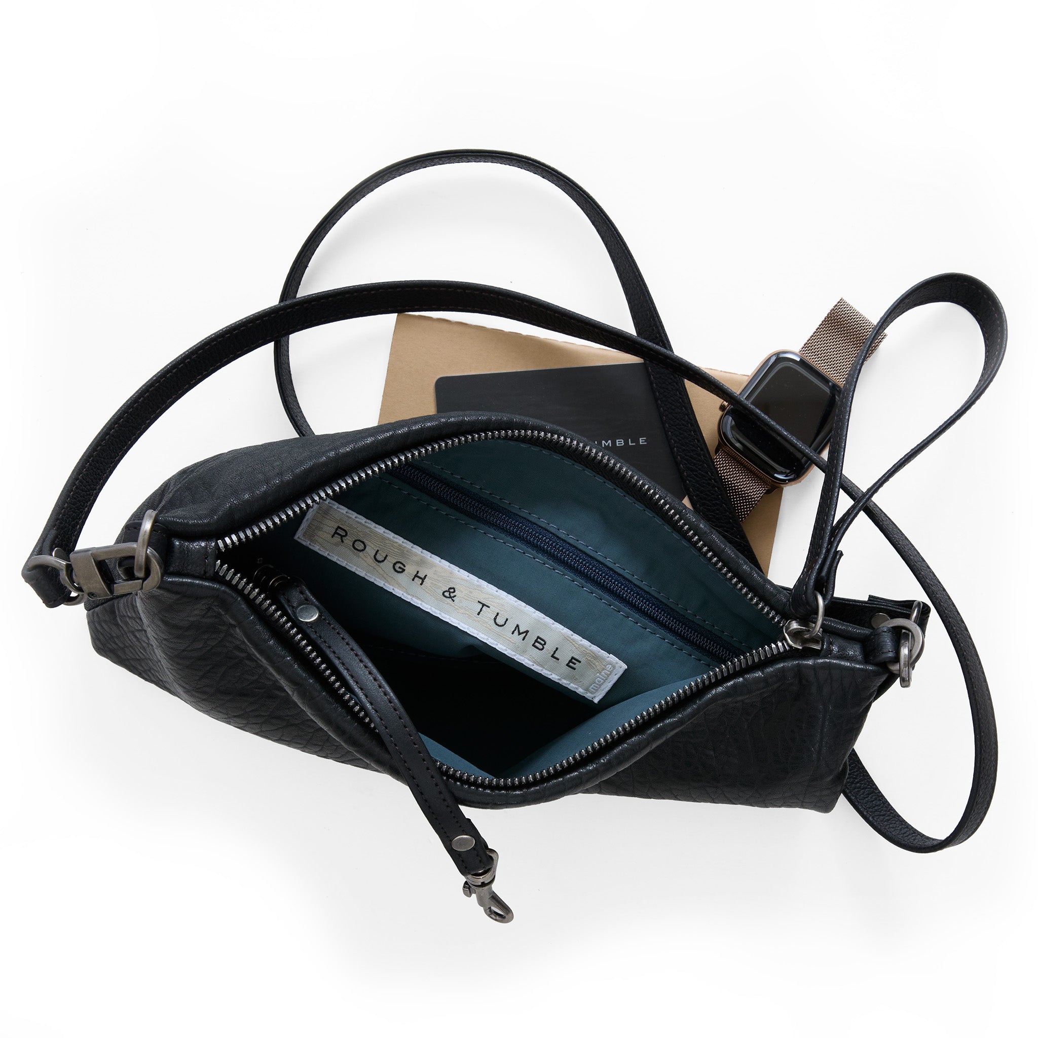 pinched bottom traveler in black pebble, showcasing interior canada blue lining