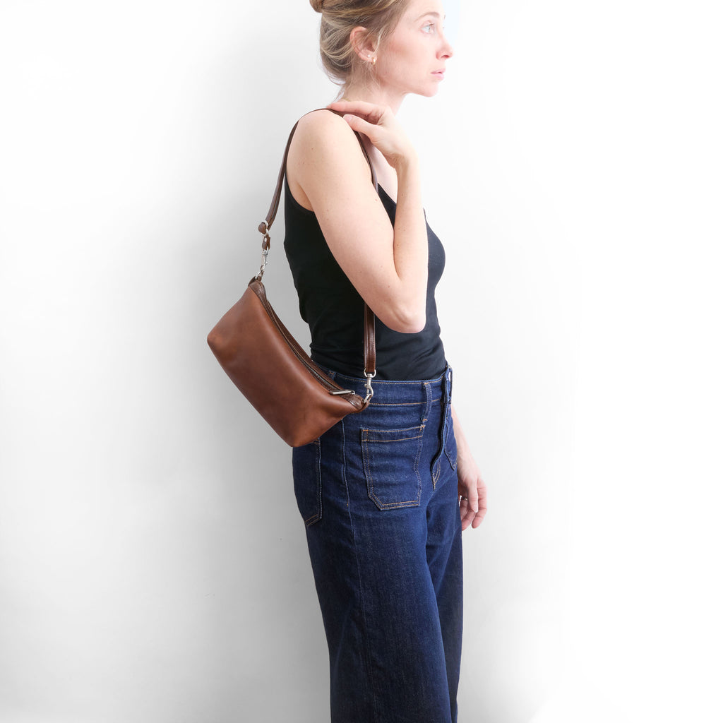 model wearing the wren in pure saddle with shortest strap  setting 